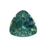 Face-up view of a 0.75 carat green trillion sapphire with teal tones and yellow-green reflections