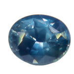 Oval Ceylon sapphire with slate-blue facets and muted blue-green reflections, viewed face-up