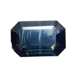 Face-up view of a 0.52 carat blue green emerald-cut sapphire