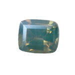 Natural parti sapphire cushion cut 0.51 carat β silky green with cloudy brilliance, unheated, ethically sourced from Madagascar.