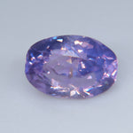 Side profile of the ovalish cushion Ceylon sapphire showing its faceted pavilion and 3.80 mm depth