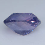 Alternate face-up view of the pinkish purple oval-cushion sapphire showing soft pink reflections