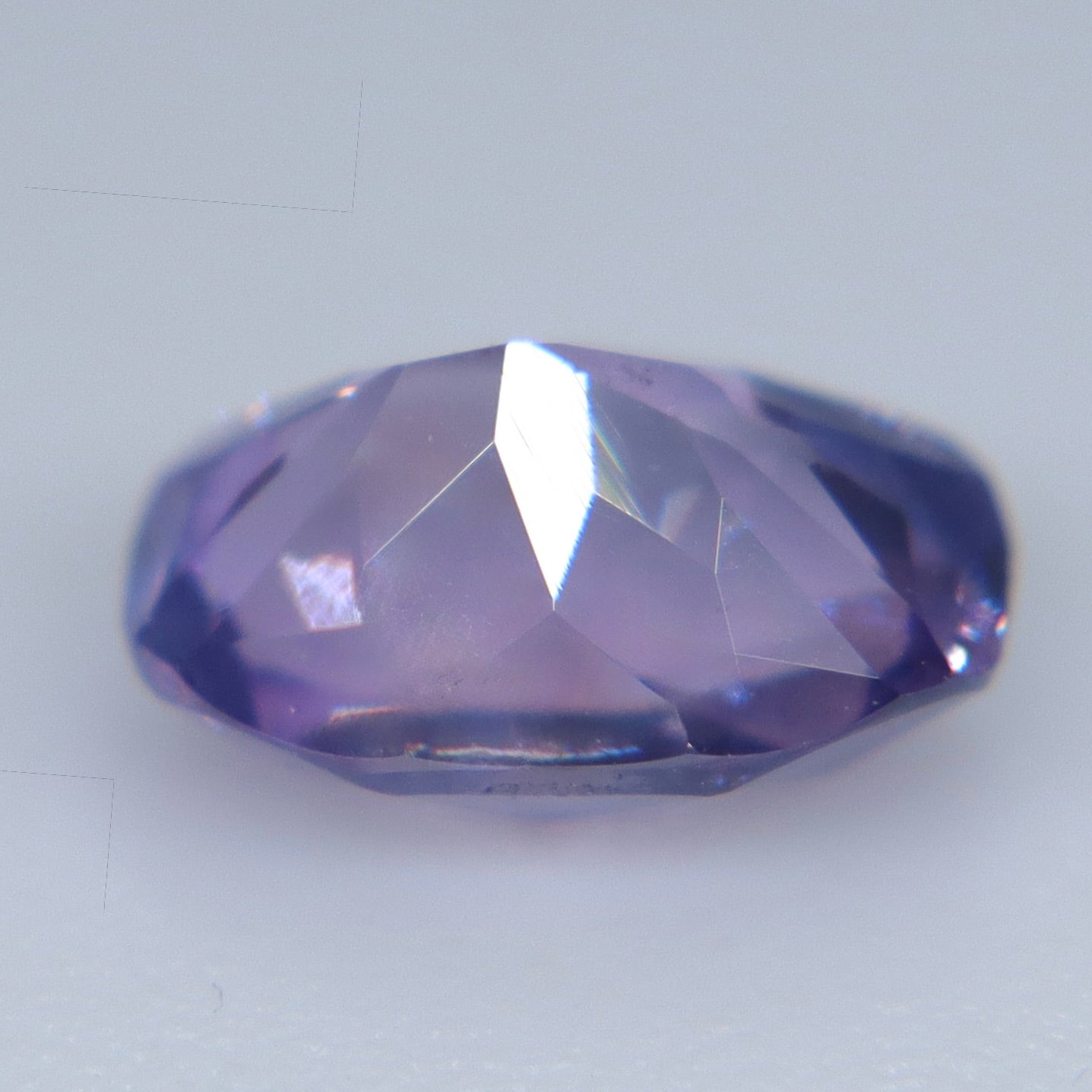 Angled pavilion view of the unheated 0.88ct Ceylon sapphire showing its modified mixed faceting