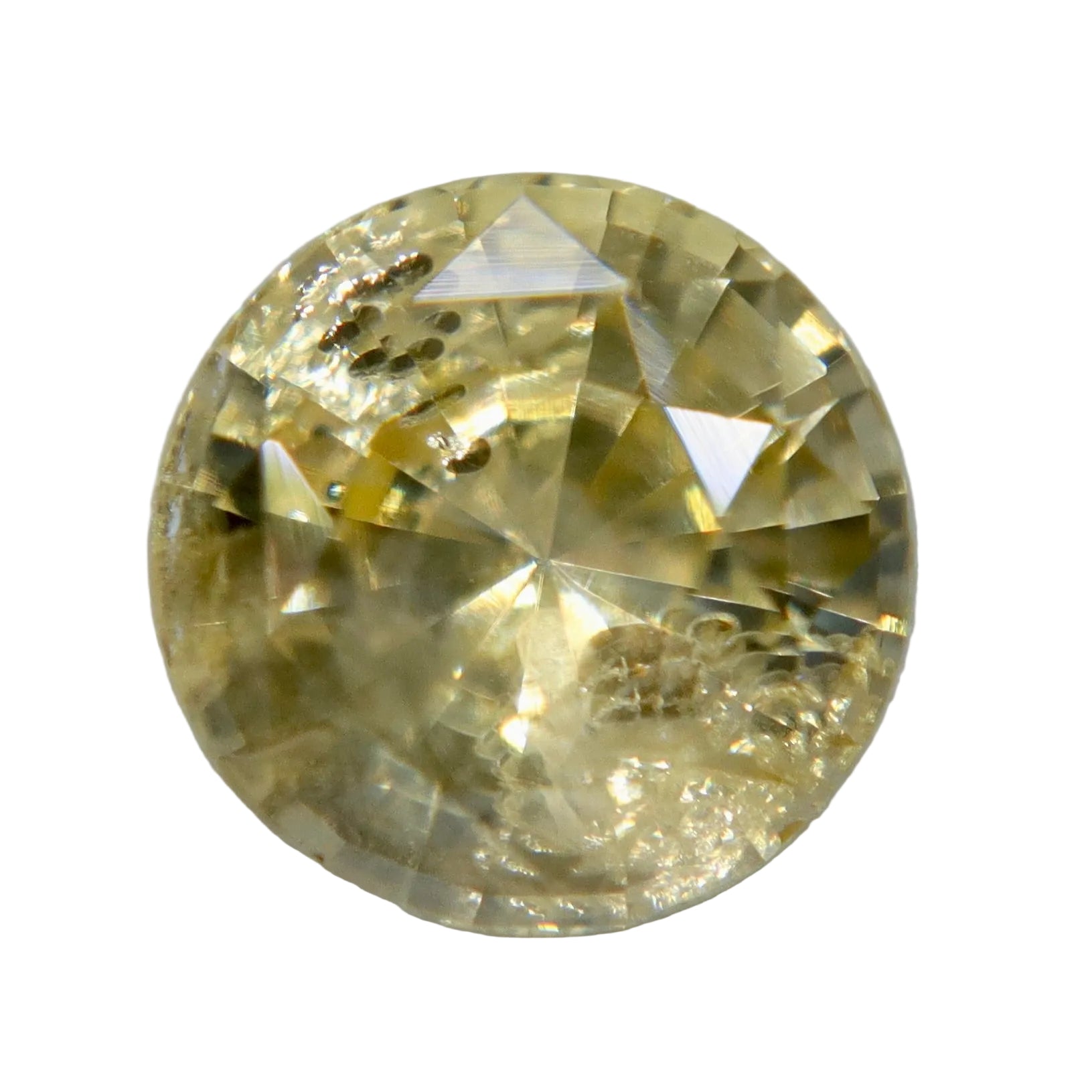 Face-up view of 1.29ct pale yellow Ceylon sapphire with round cut and visible natural inclusions