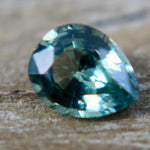 1. Underside view of a green pear sapphire showing its pavilion facets.