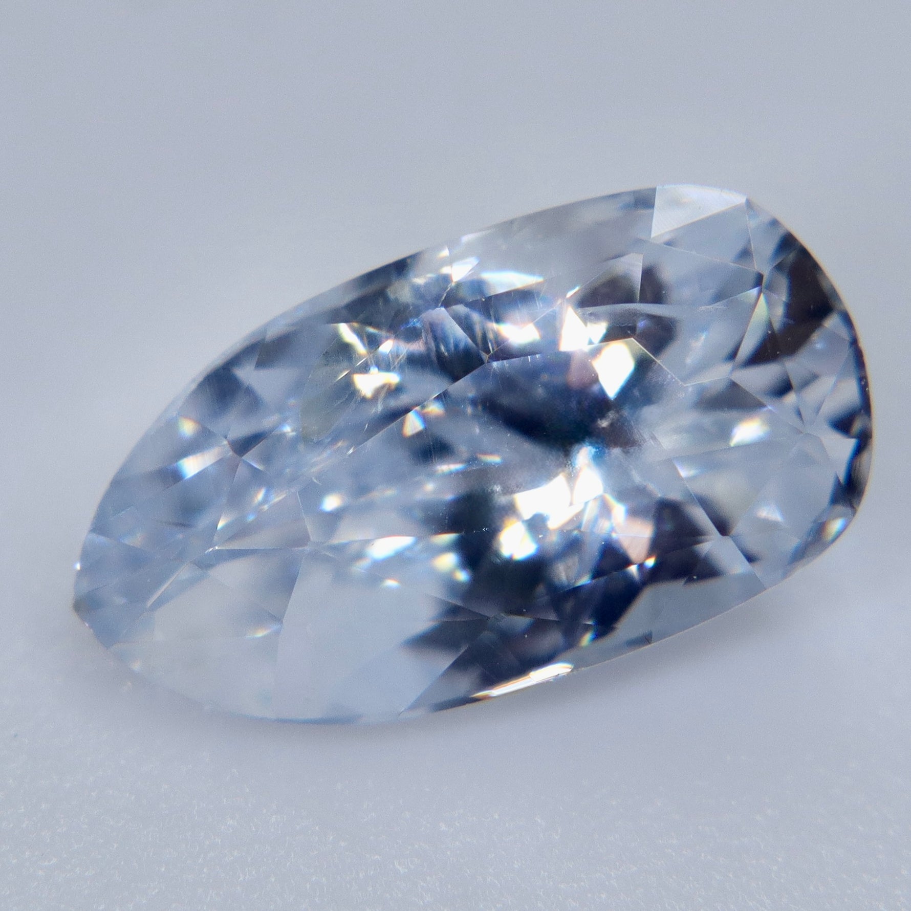 loose 2.70ct Ceylon white sapphire shown on a hand for approximate size comparison