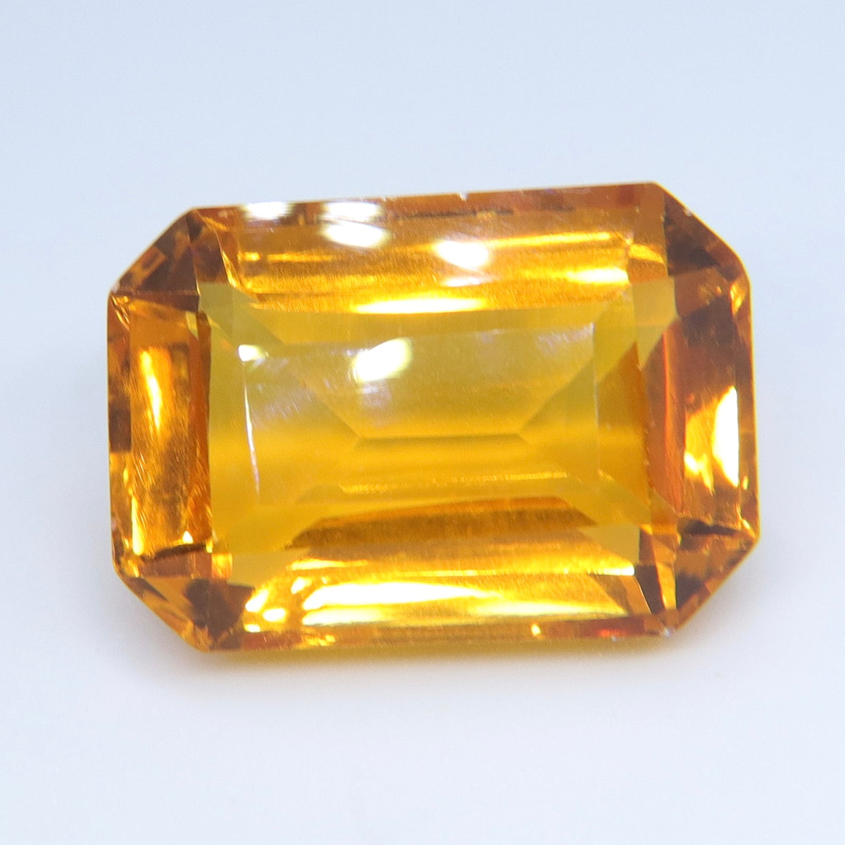 Close-up of the broad table and surrounding step facets of a golden citrine