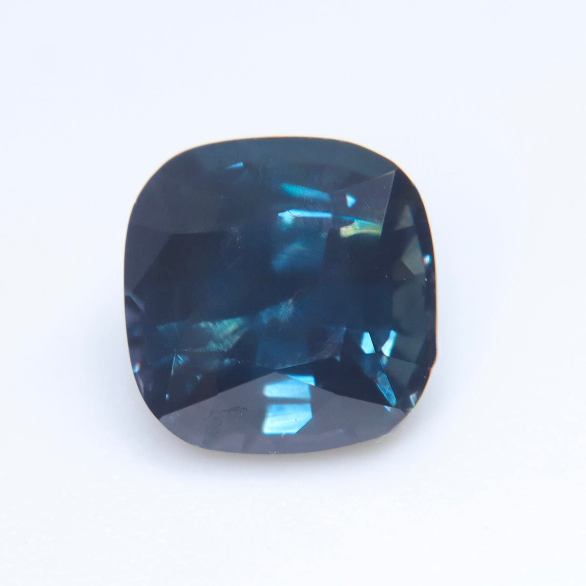 Close-up of the table and rounded corners of a deep blue sapphire