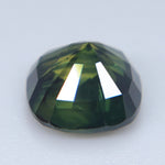 Deep forest-green Australian sapphire with olive reflections and VS clarity