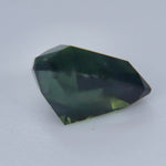 Deep green unheated Australian parti sapphire showing teal flashes, 1.47 carats