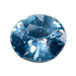 Face-up close-up of a 0.80 ct oval teal sapphire with blue tones and bright facet reflections