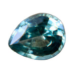 Face-up view of a 0.66 carat natural green pear-cut sapphire.