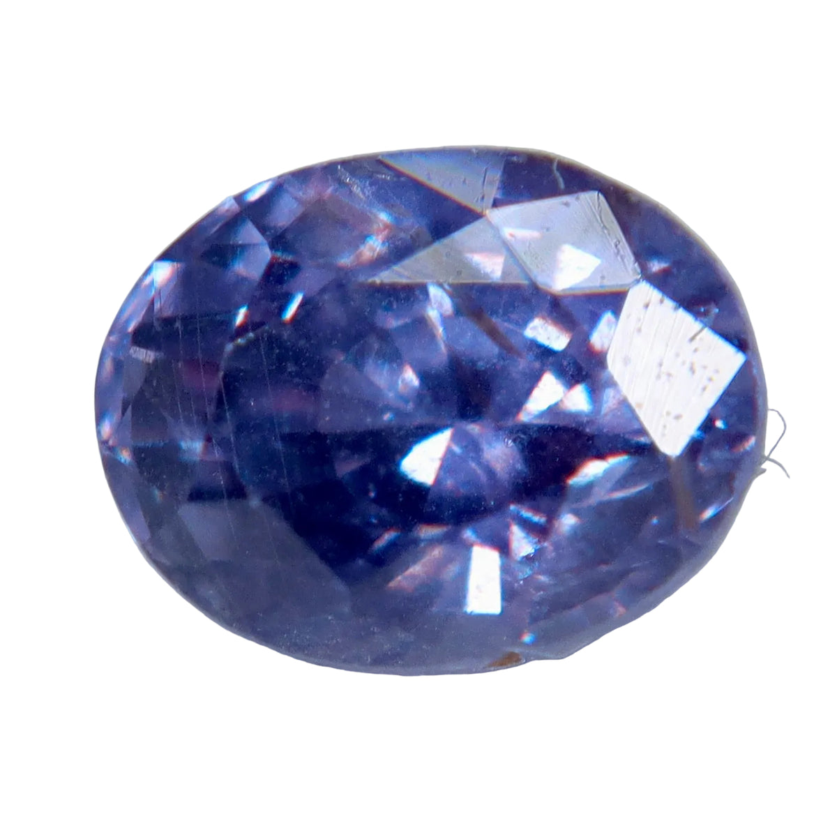 Face-up view of a 1.02 ct oval purple sapphire showing violet tones and visible inclusions