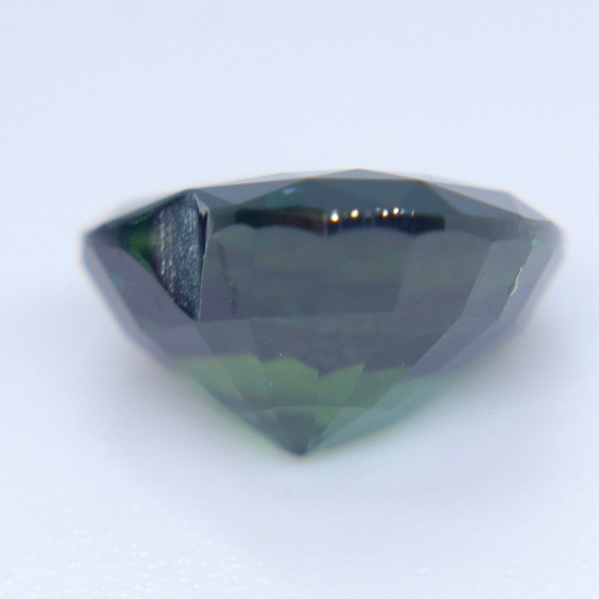 Heart-cut Australian green sapphire with VVS clarity and faceted crown