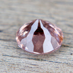 Faceted gemstone on a textured surface