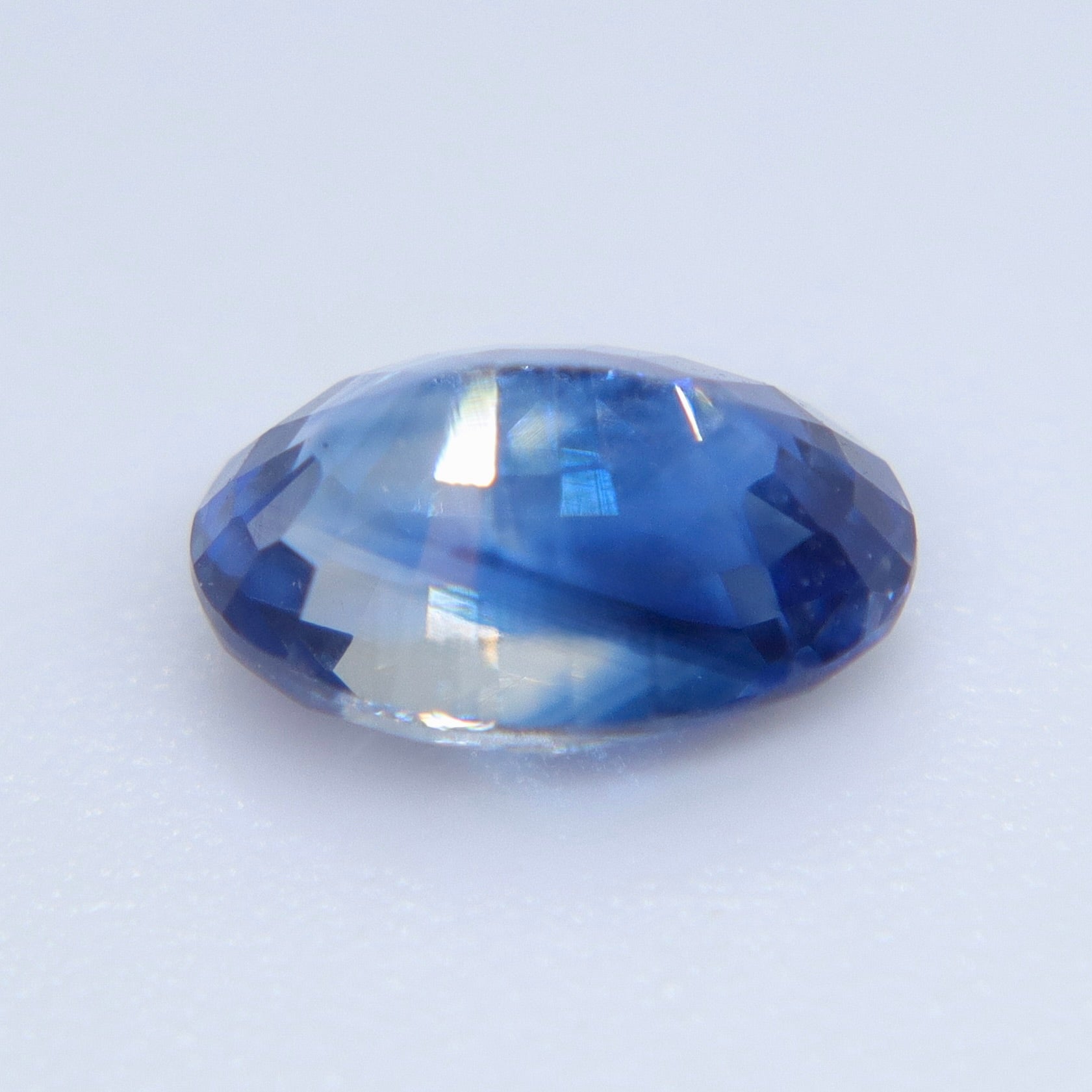 Oval blue sapphire 6.85x4.65mm faceted gemstone for engagement ring and fine jewelry