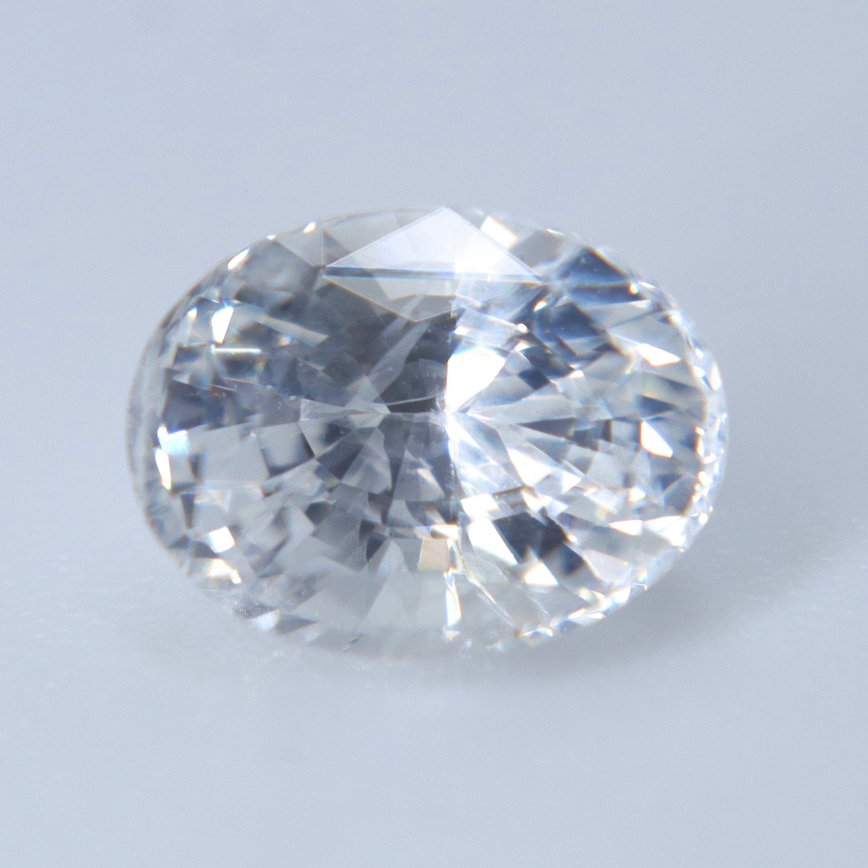 faceted natural colorless sapphire gemstone for bespoke jewelry and fine jewelry