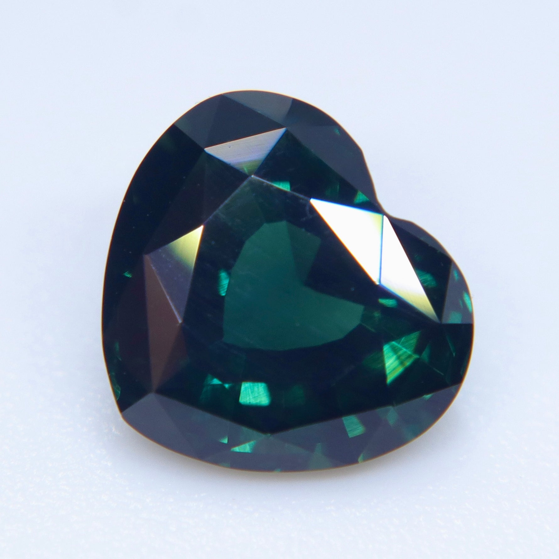 Loose natural green heart-shaped sapphire gemstone from Australia