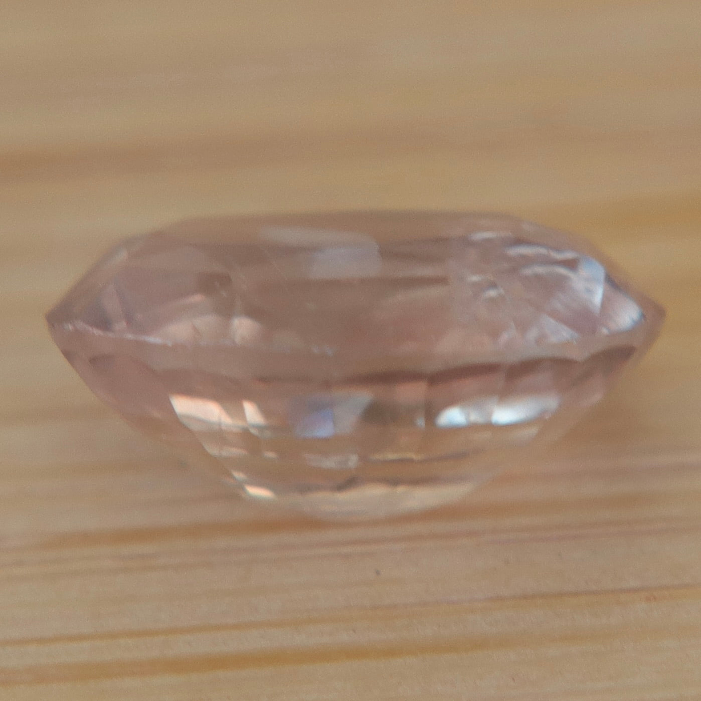 Oval Ceylon sapphire showing natural inclusions and faceting