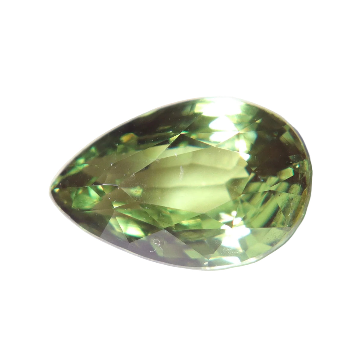 Pear-cut 1.54 ct natural Ceylon alexandrite showing green tones on a white background.
