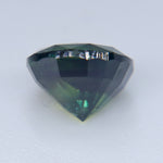 Rectangular cushion cut Australian green sapphire showing faceted crown