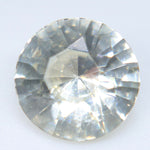 Round natural white sapphire viewed under light for a bespoke ring or pendant