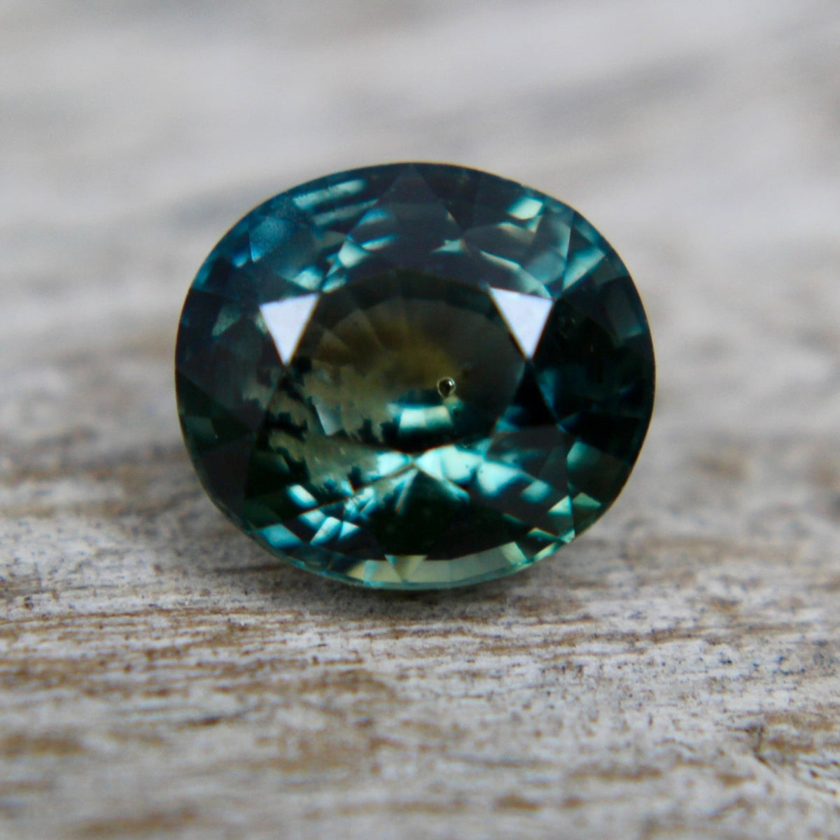 Side profile of the oval Madagascar sapphire showing its 4.10 mm depth