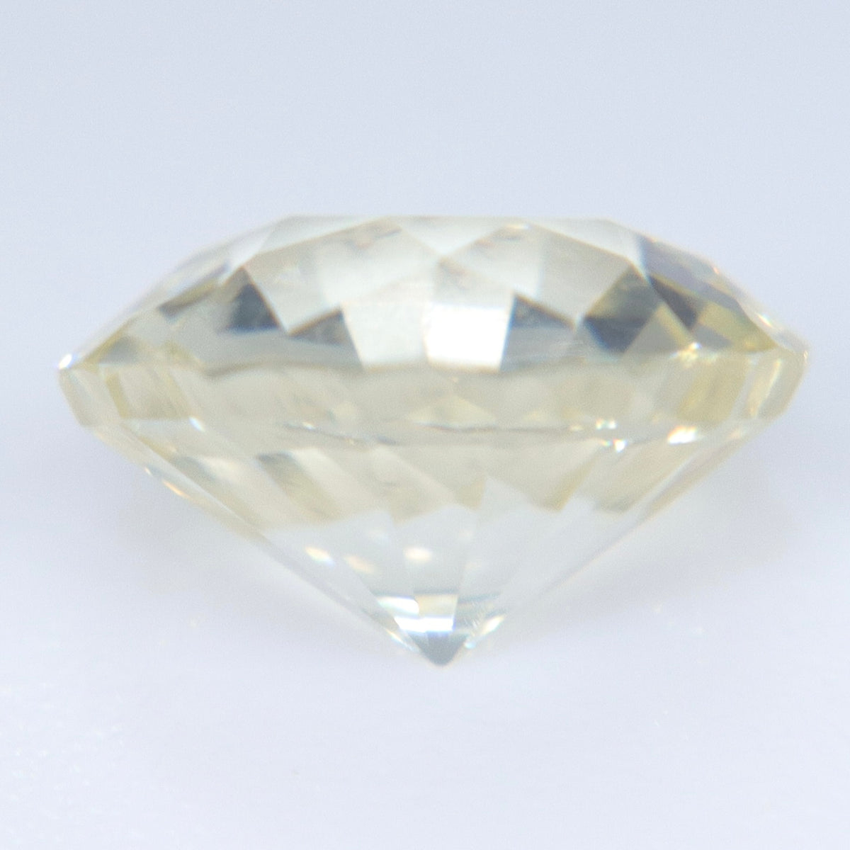 Side view of 1.34 carat natural white sapphire measuring 6.68 by 4.22 mm