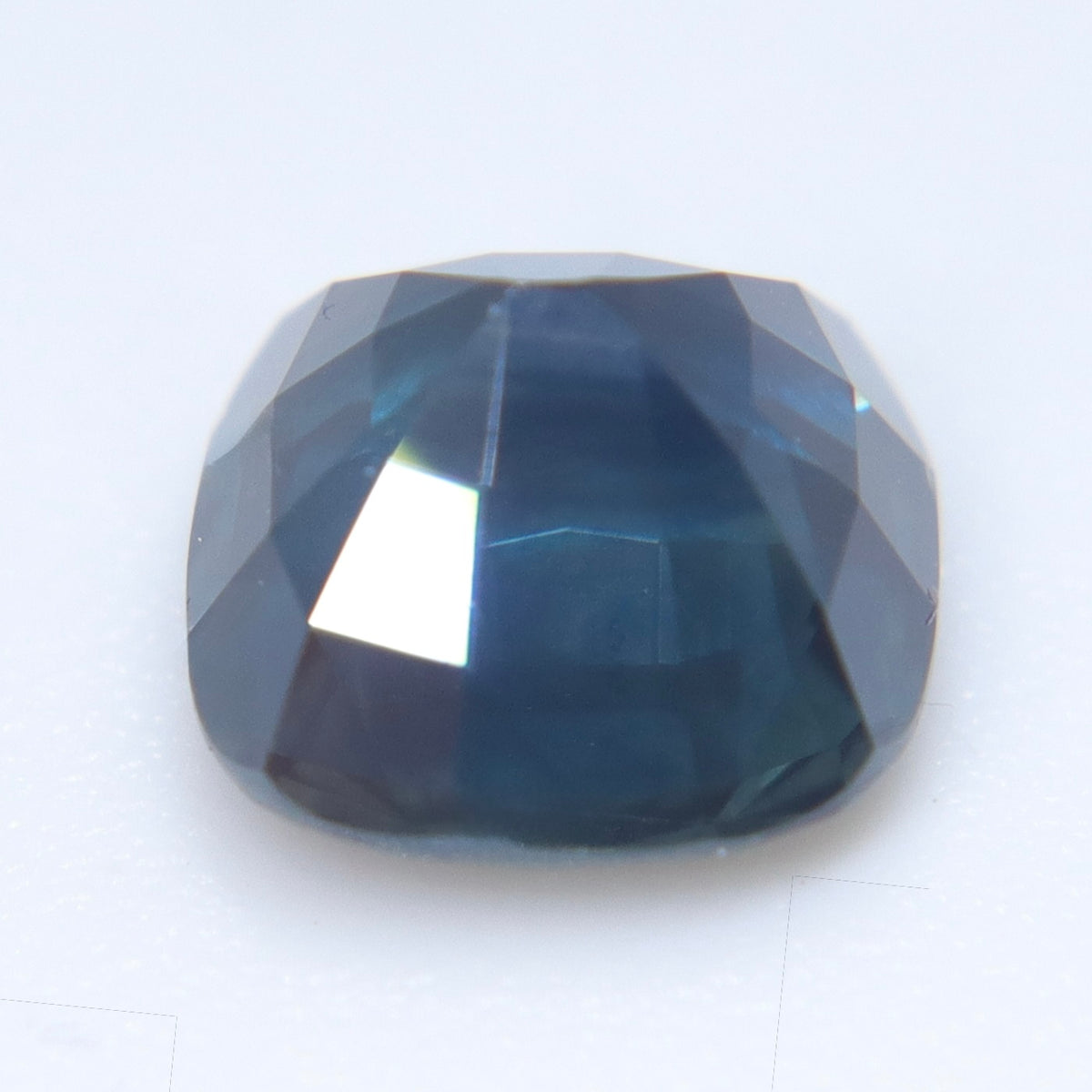 Side view of Australian cushion cut sapphire showing its depth