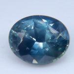 Side view of an oval sapphire showing its pavilion depth and internal features