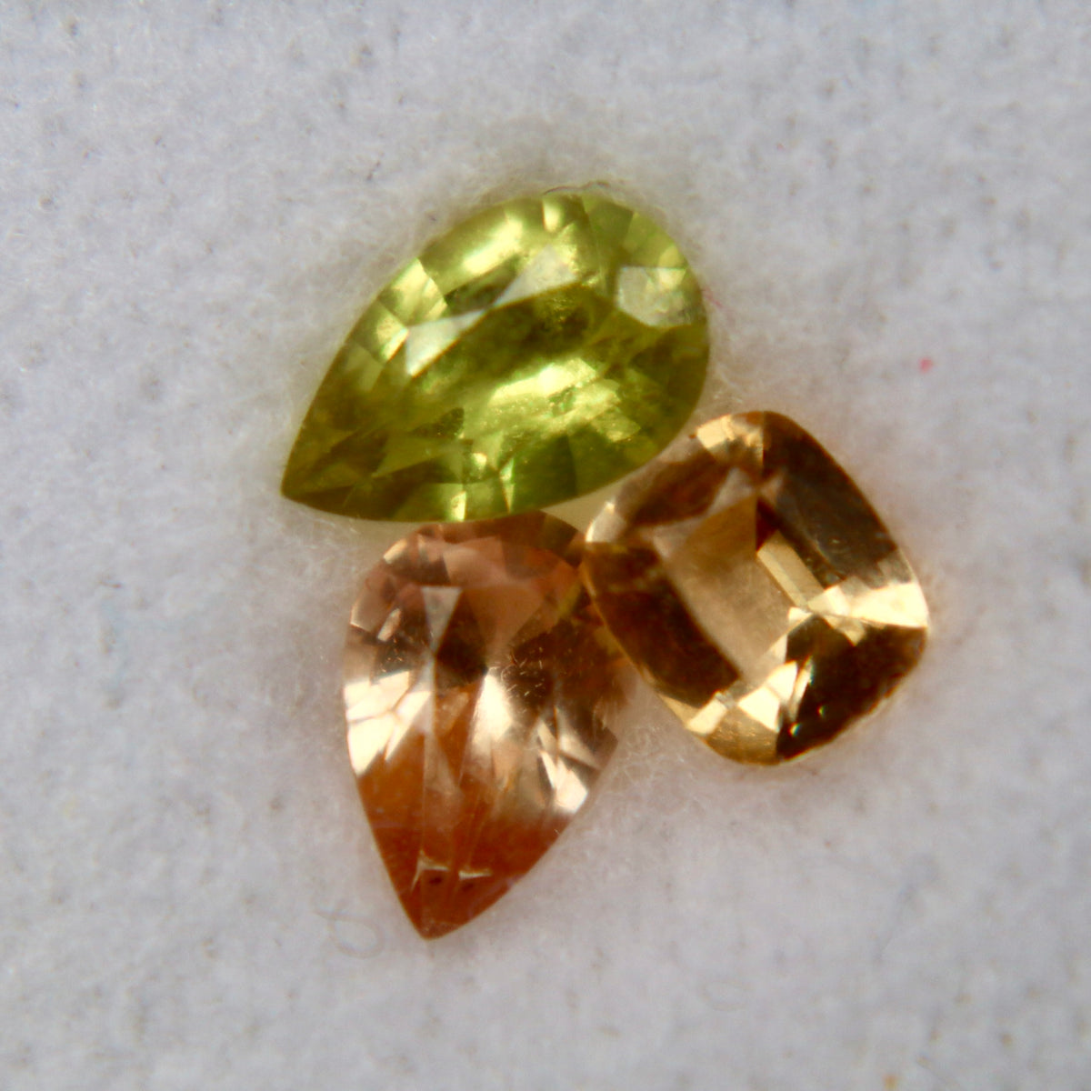 Untreated 0.28 carat peach cushion-cut Ceylon sapphire measuring 4.20 by 3.55 mm