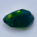VVS Australian parti sapphire loose gemstone photographed from an angled view