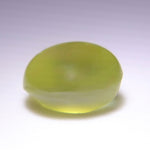 Yellow-green Ceylon chrysoberyl showing a bright cat’s-eye band under direct light