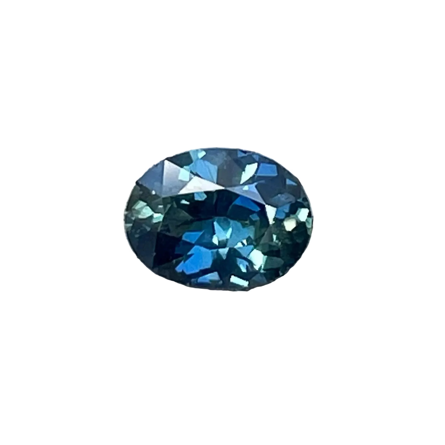 Face-up view of a 0.50 carat oval blue green sapphire