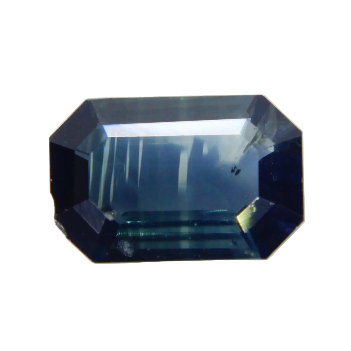 Face-up view of a 0.52 carat blue green emerald-cut sapphire