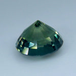 Natural blue-green sapphire measuring approximately 5.96 by 5.65 mm