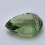 1.16 carat Ceylon alexandrite displaying warm brown and golden tones under warm lighting
