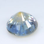 Round Ceylon sapphire displaying pale blue and yellow color zoning