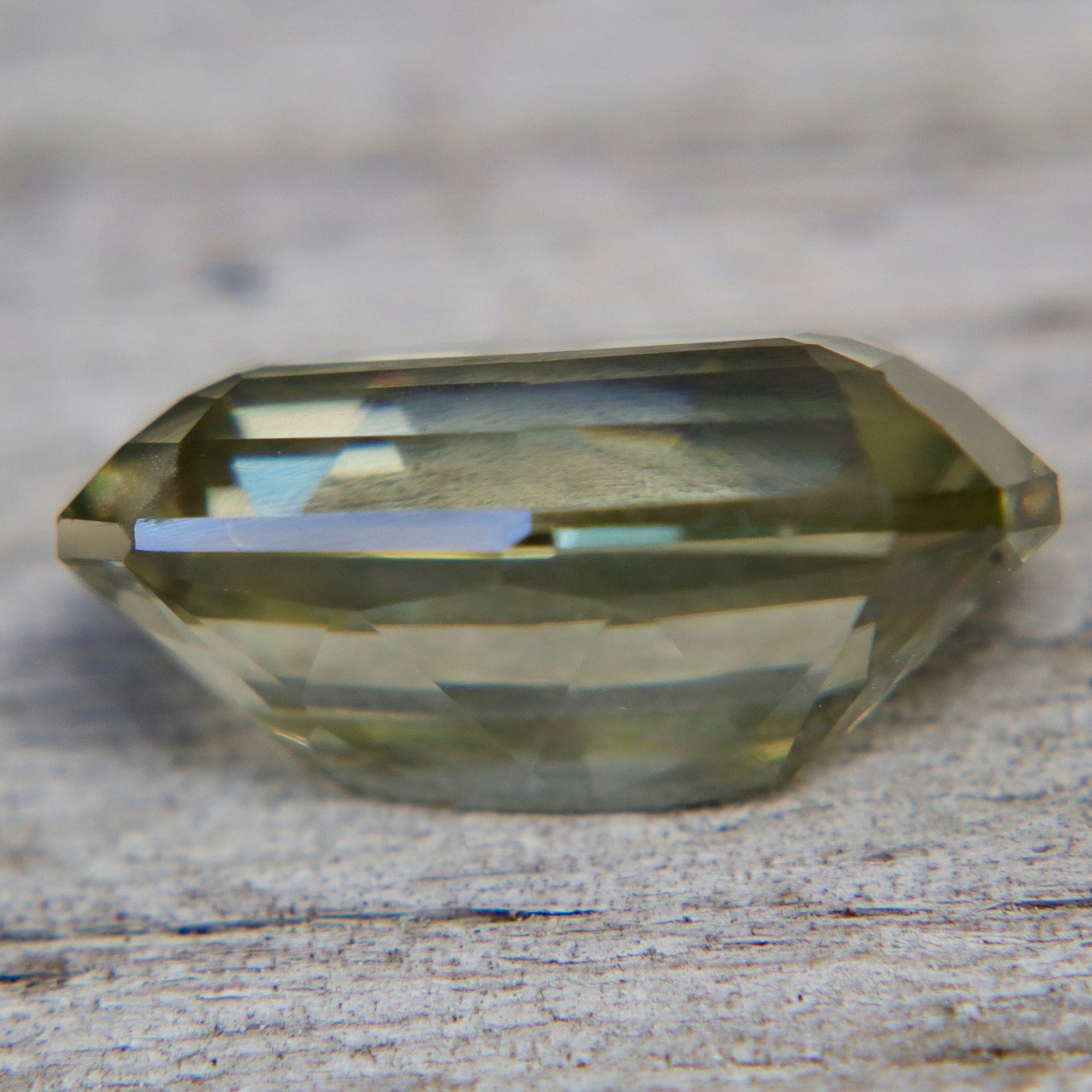 Ceylon chrysoberyl displaying purple fluorescence under ultraviolet light