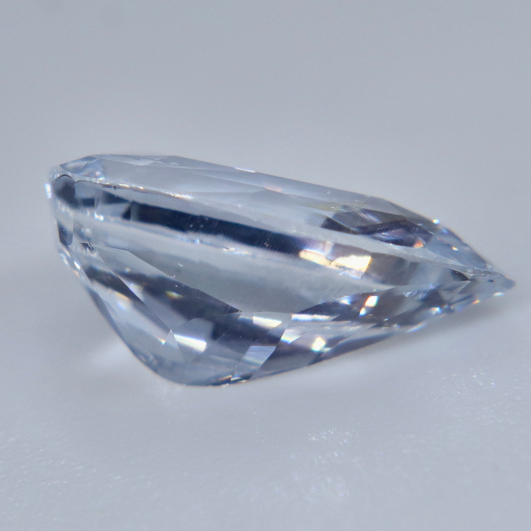 Alt: Pavilion view of elongated natural white sapphire from Ceylon with VS clarity