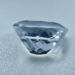 Cushion-cut Ceylon white sapphire showing its VVS clarity and faceted surface