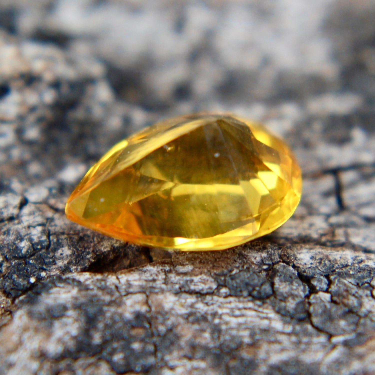 Natural Ceylon yellow sapphire showing pear-cut facets and VS clarity