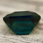 Deep green emerald cut Australian sapphire with VVS clarity