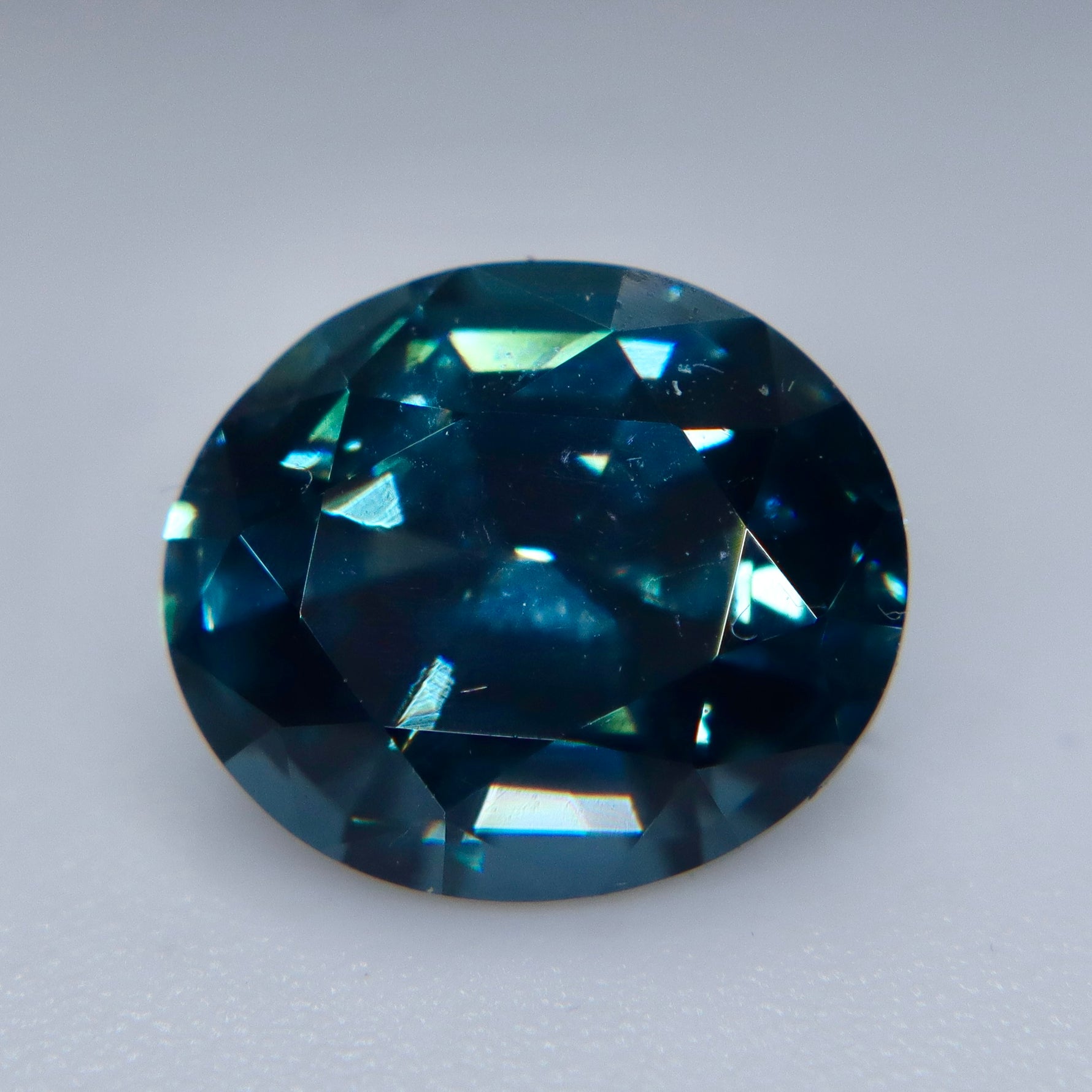 Facet detail of a deep teal blue natural spinel with VS clarity