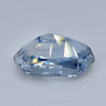 ngled view of an elongated cushion white sapphire with icy blue-gray reflections