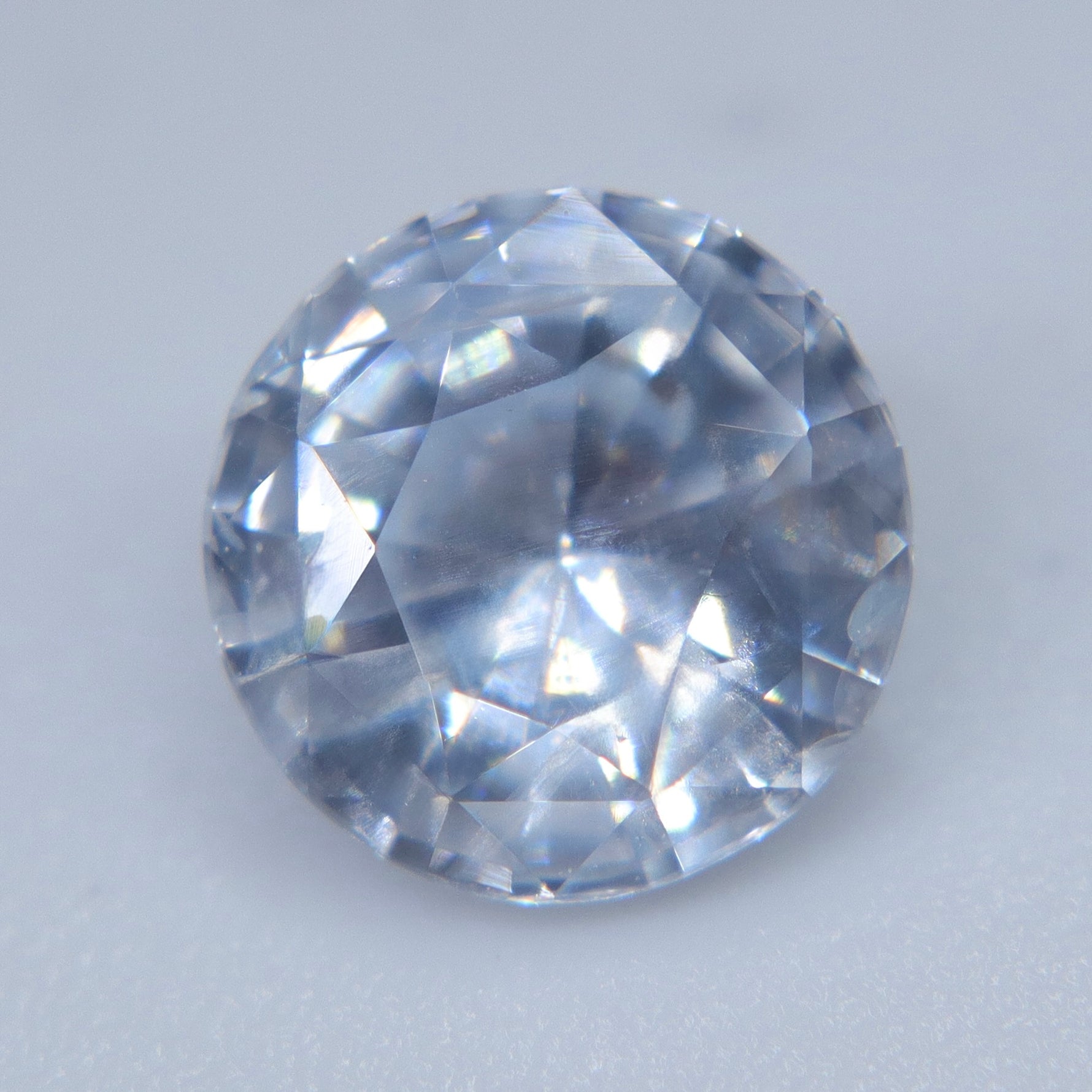Eye-clean round white sapphire loose gemstone for a custom jewelry setting