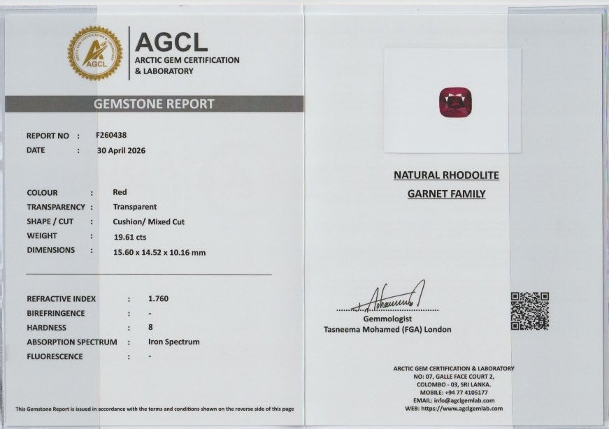 gemstone report with a natural rhodolite garnet on a white background