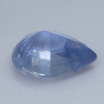 Heated natural blue Ceylon sapphire in a pear cut showing visible SI clarity characteristics