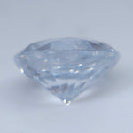 Heated natural white sapphire weighing 1.34 carats in a round faceted cut