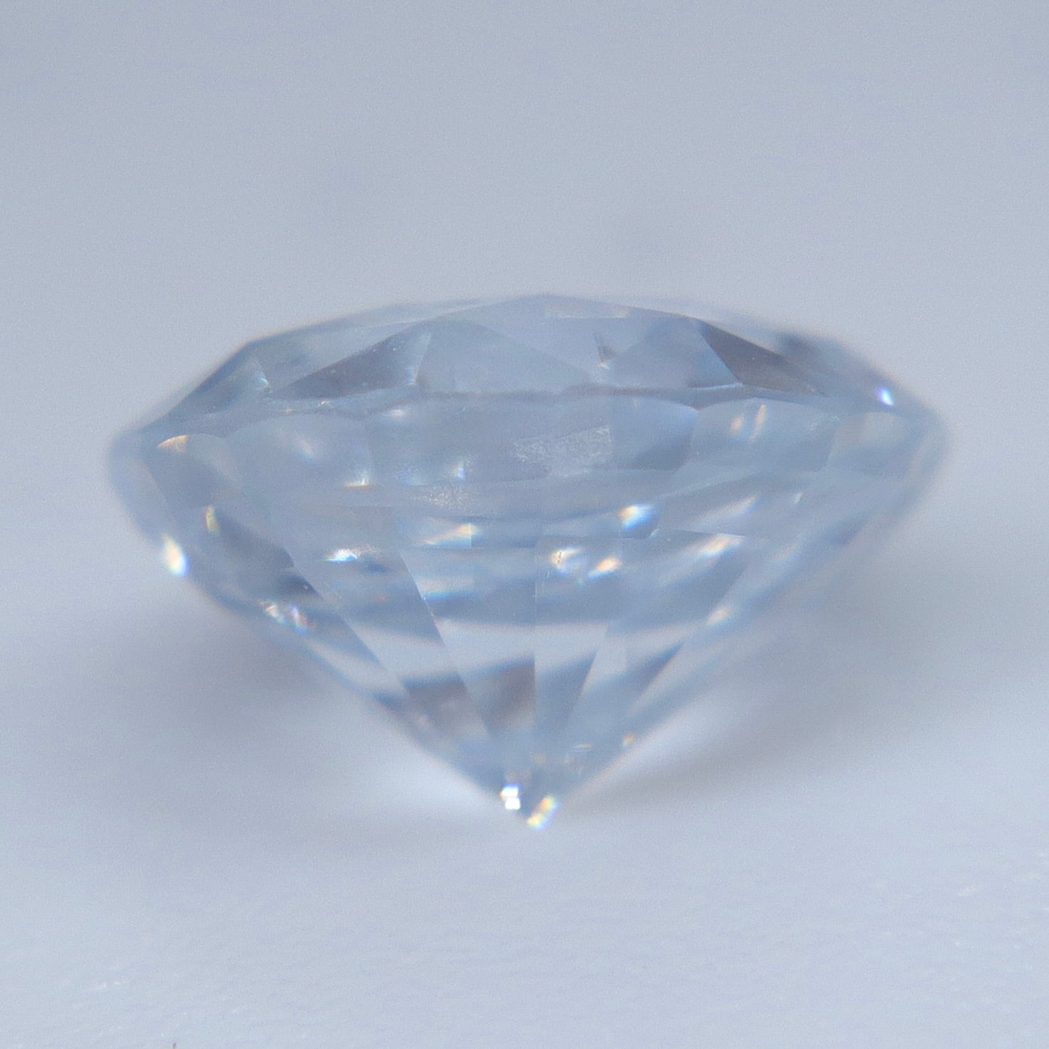 Heated natural white sapphire weighing 1.34 carats in a round faceted cut